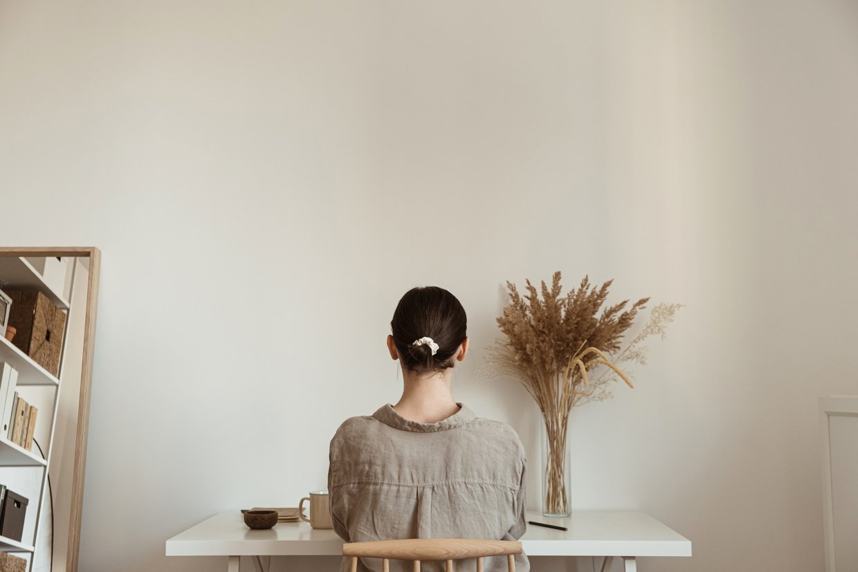 Woman Working in a Minimalist Home Office